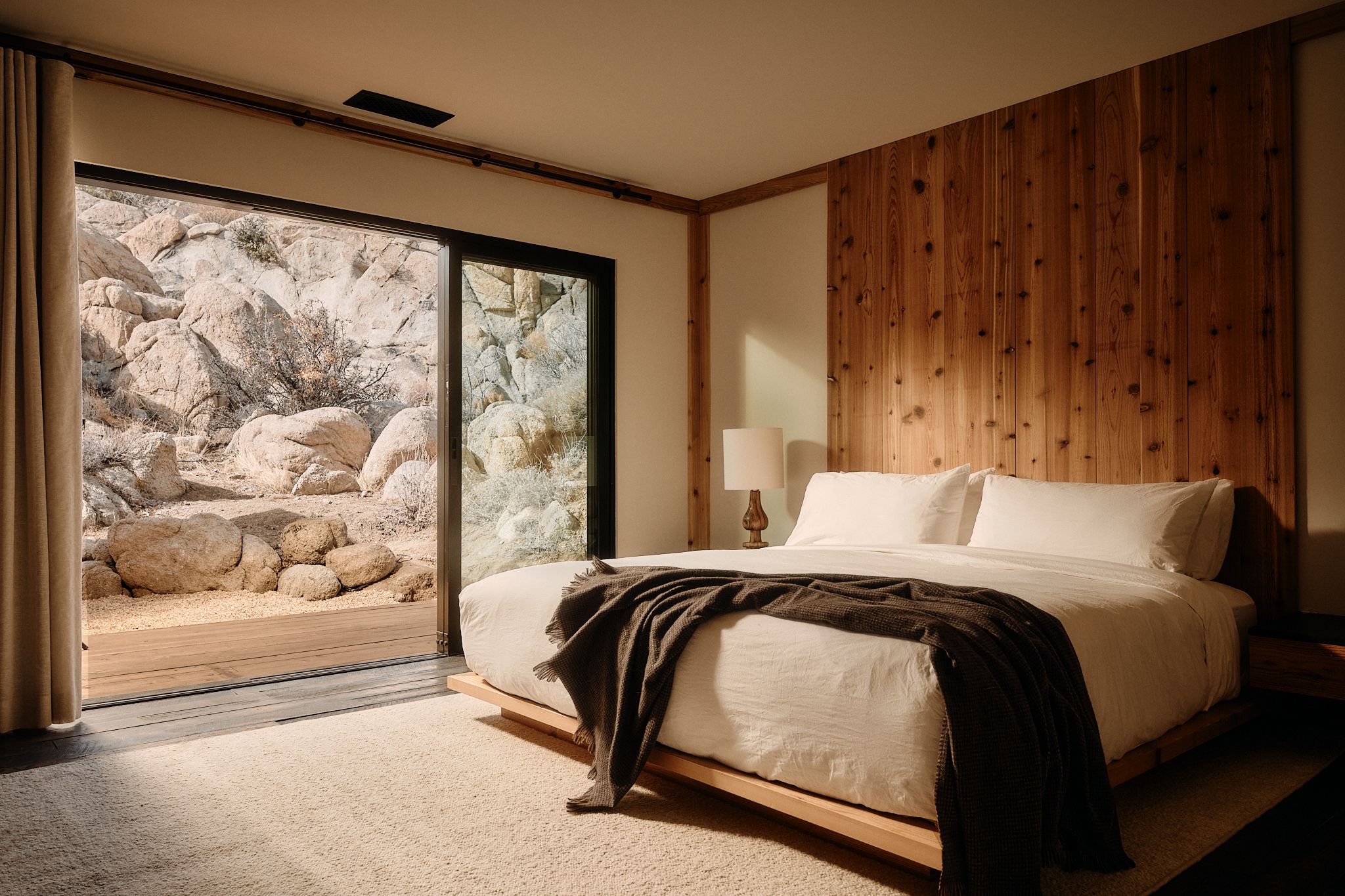 The bedroom, doors to the boulders